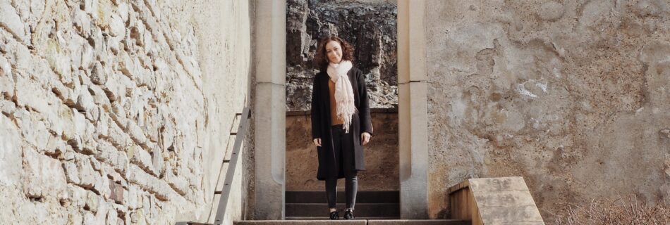 Exploring and smiling for the camera in a castle in prague