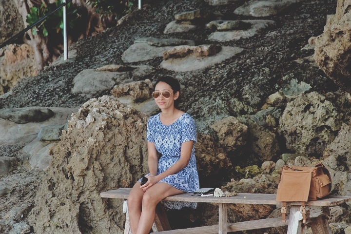 Sitting on the bench on the beach at Cafe by the Sea in Okinawa. Waiting for our turn to dine in.